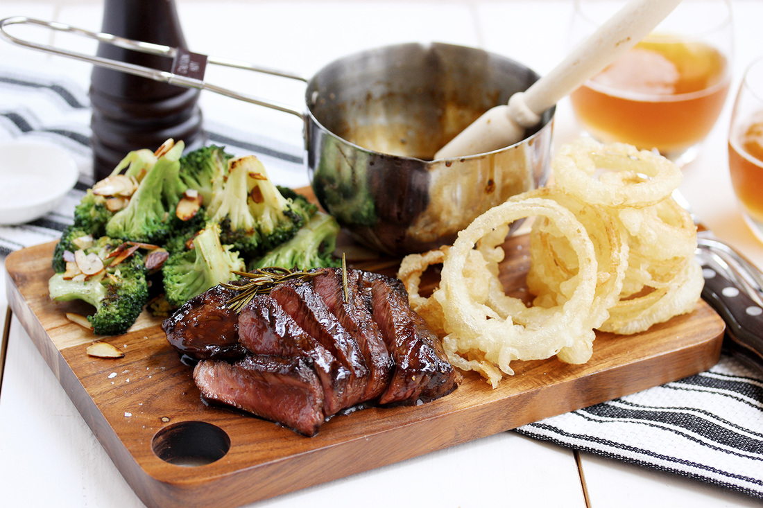 Whiskey glazed steak with onion rings